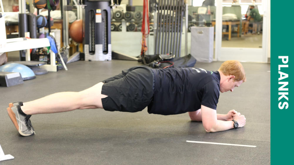 A man demonstrating a plank exercise
