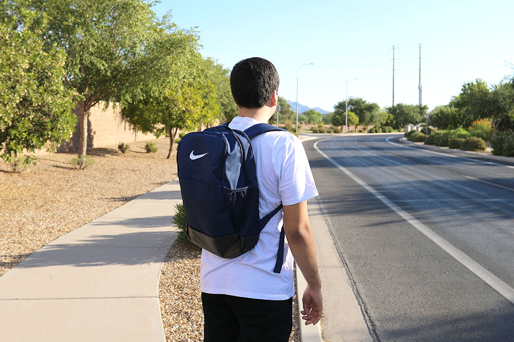 View of student wearing a backpack.
