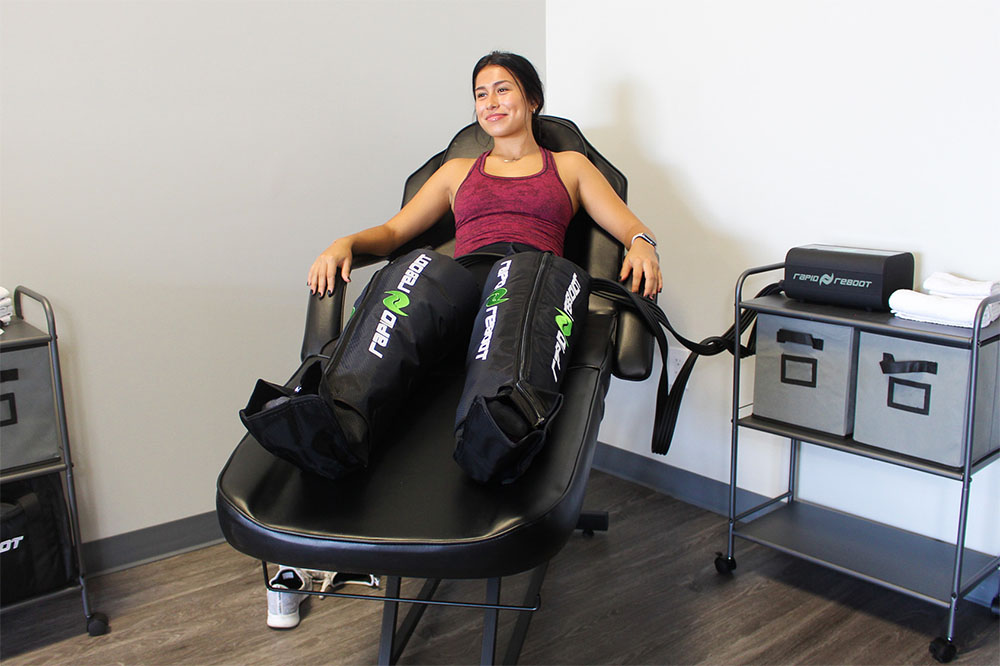 Athlete using compression therapy to recover.