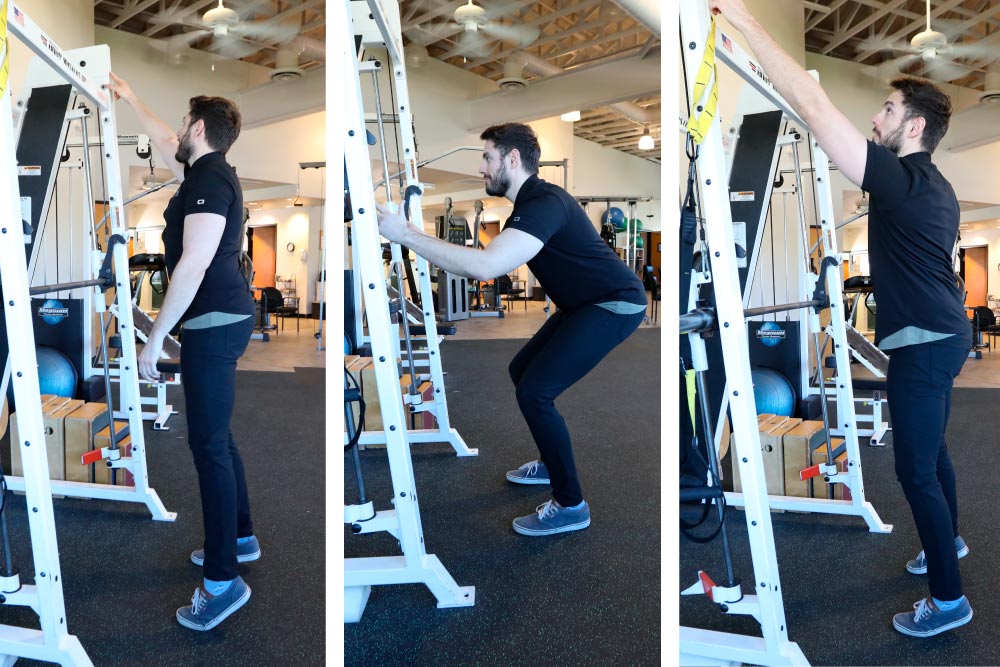 Sit to squat overhead reach exercise