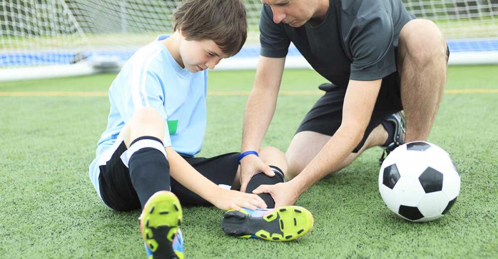 Youth soccer athlete with a common sports injury; sprained ankle.