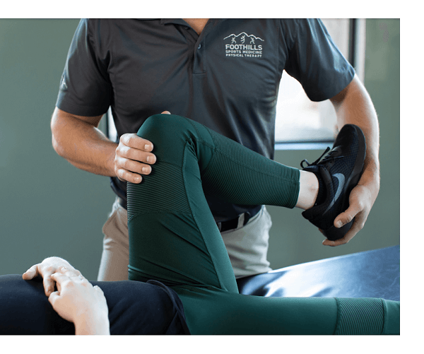 Physical therapist working on a patients knee