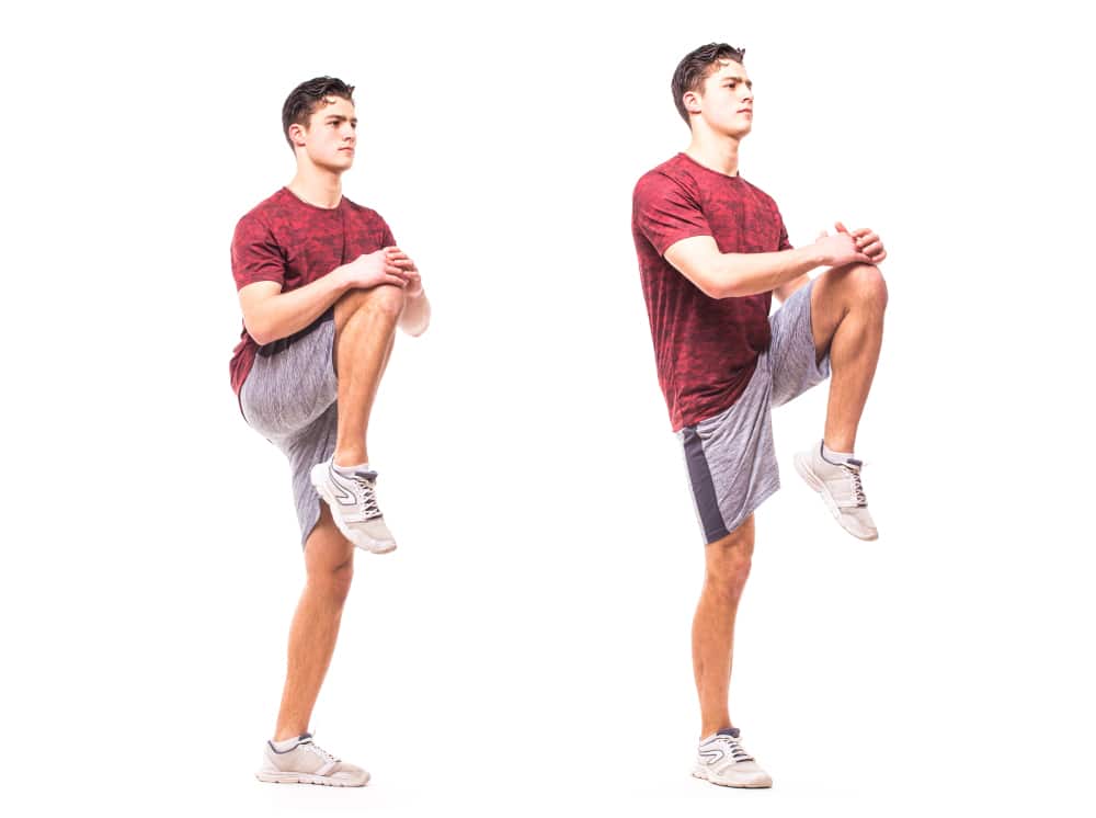 Knee to chest exercise for dynamic warmup.