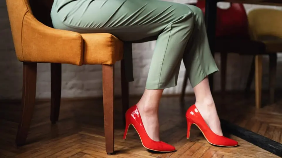 Woman wearing high heels while sitting.