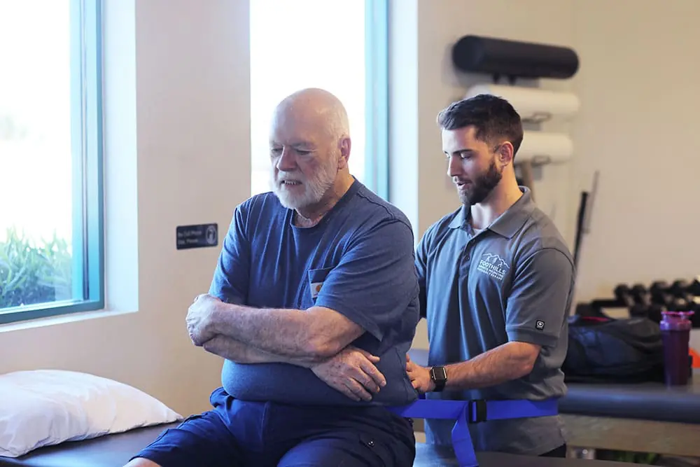 Therapist helping patient with complex pain syndrome.