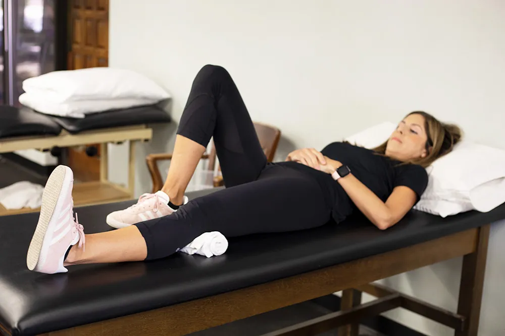 PT, Melissa Miller demonstrating quad set exercise.
