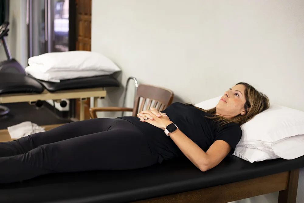 PT, Melissa Miller demonstrating gluteal set exercise.