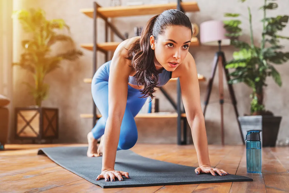 Young woman doing yoga exercises.