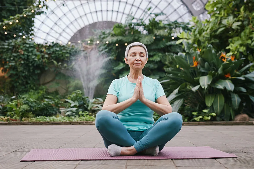 Older woman meditating.
