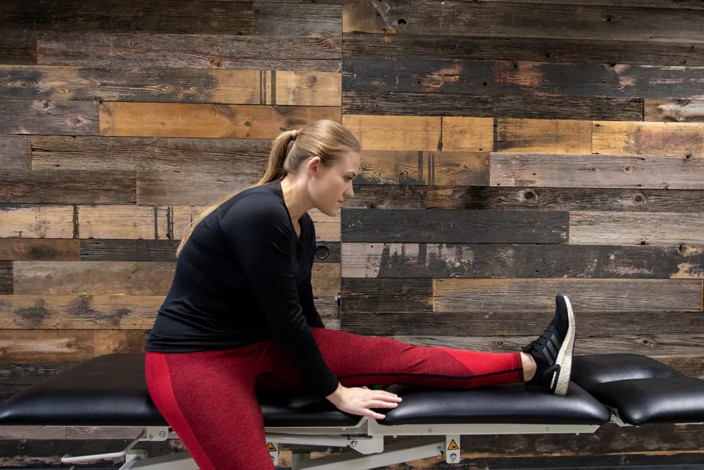 Woman stretching hamstring