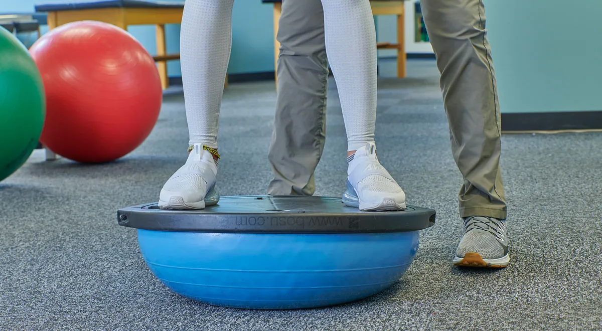 Feet on stability ball.