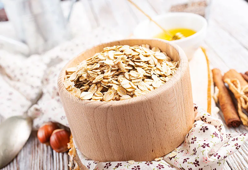 A wooden bowl of protein rich oats.