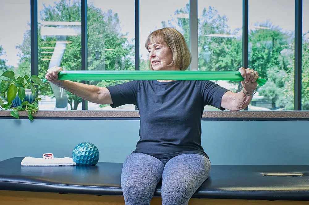 Women performing resistance band exercise.