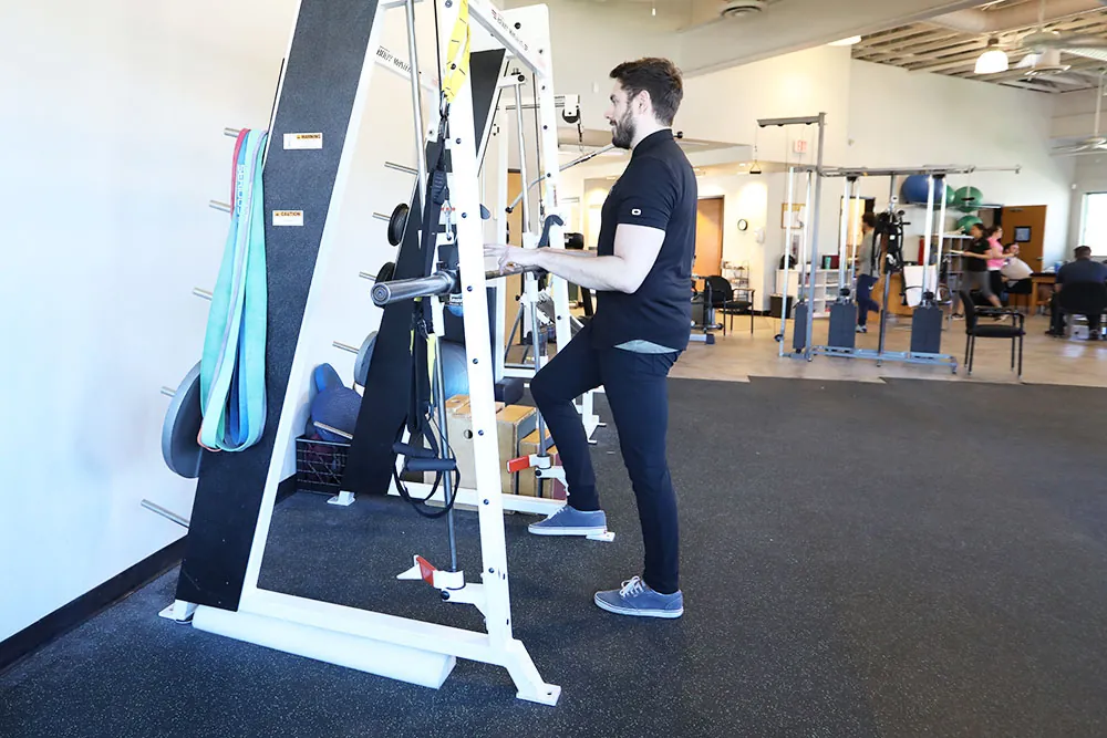 Man balancing on one leg.