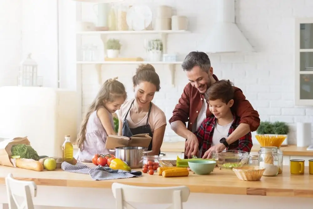 family preparing a meal in a kitchen