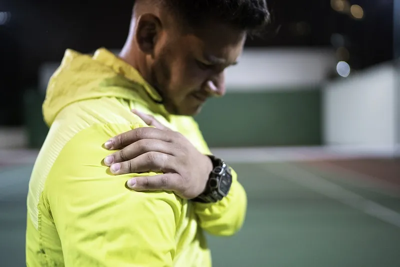 Man with shoulder injury from playing pickleball.