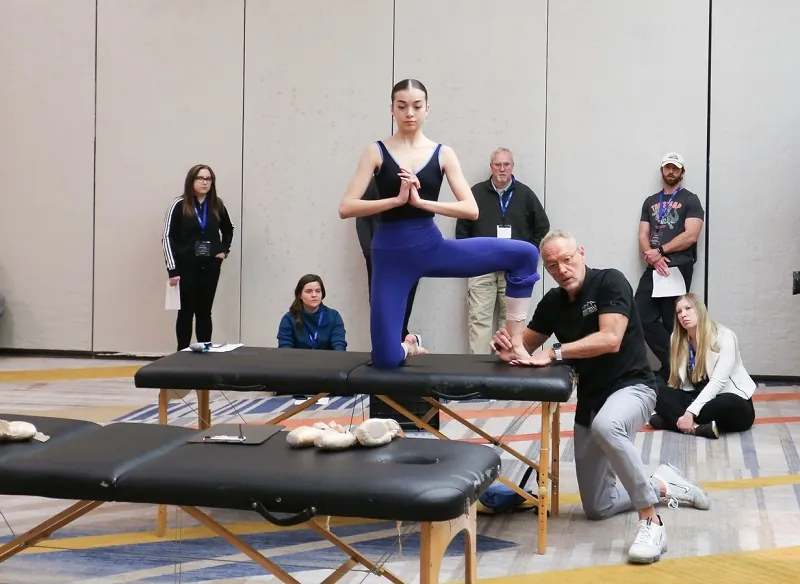 Ballet dancer being evaluated by a physical therapist.