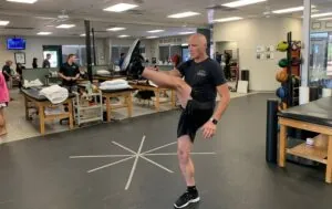 Athlete performing high kick stretch.