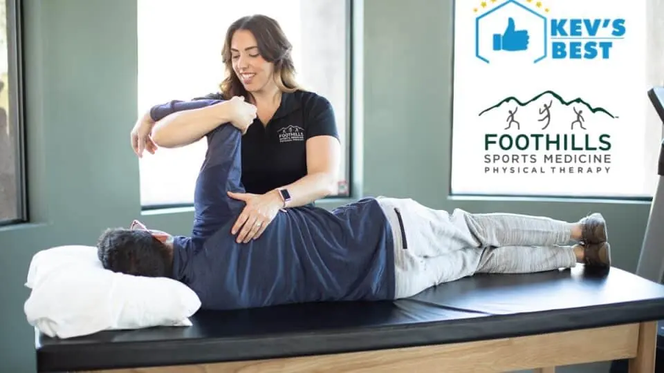 Physical Therapist working on a patients shoulder.