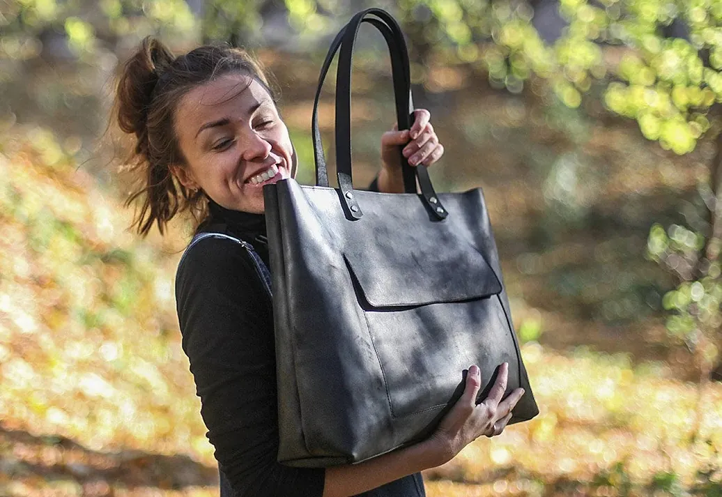 Woman carrying a large purse.